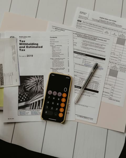 Receipts and a calculator on a desk