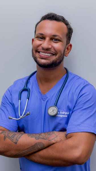 Smiling dentist in scrubs